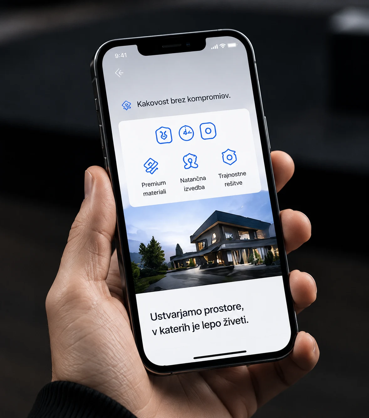 A website shown on a phone held in a hand